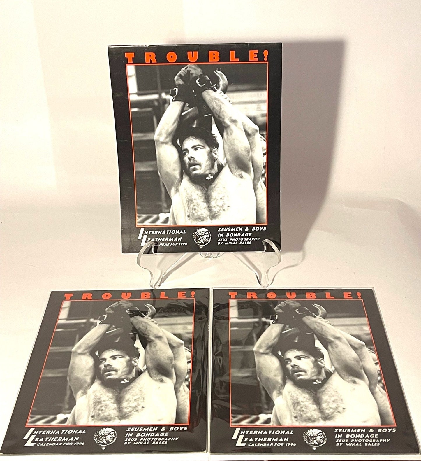 Trouble! International Leatherman calendar for 1996; including the 22" tall pull out poster of Jake Drummond Zeusmen by Mikal Bales. Mature